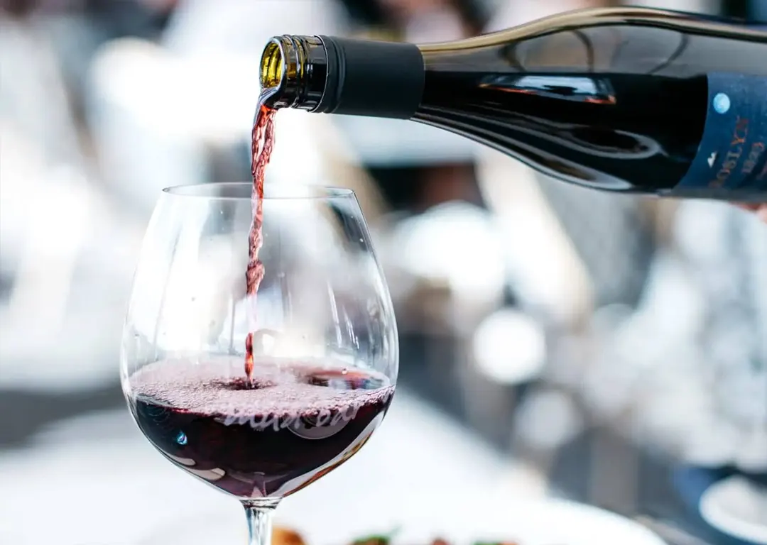 Wine being poured at Mudbars waterfront bar